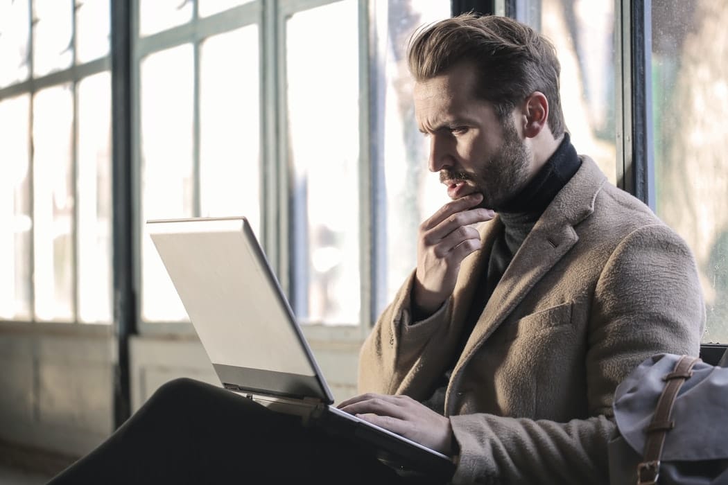 Man using a laptop.